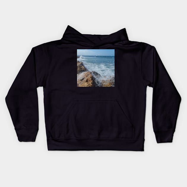 Rock beach, On the rocks, ocean waves surfing the rocks of a splashing dashing restless Caribbean Sea Kids Hoodie by Artonmytee